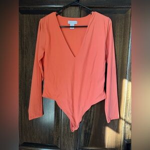 House of Harlow bodysuit. Size large. Coral orange color. ￼